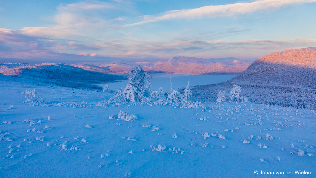 The pink color of the arctic...Made during the Arctic Aurora Chase 2019 #aac2019On one very cold morning near Kilpisjärvi, Finland, we climbed with snowshoes on the hill to have look over the border towards Sweden. The sun was rising from behind, shining with its special pink color on the snowy mountains...regards, Johan van der Wielen